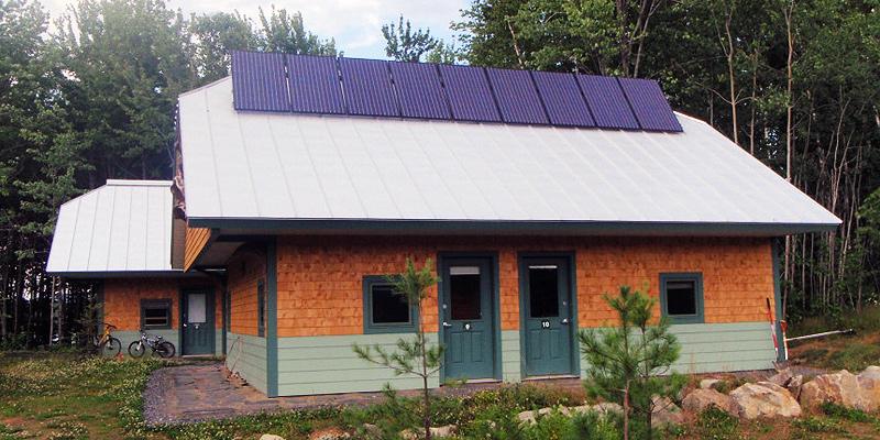 Roof-mounted solar panel array at the huts